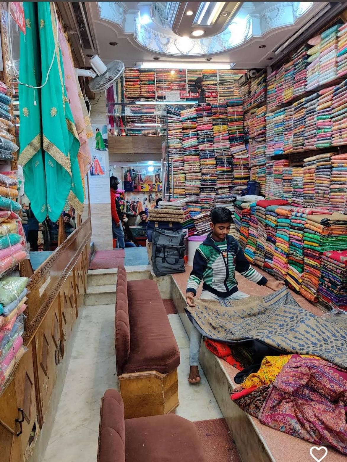 Walls of folded fabric inside the shop